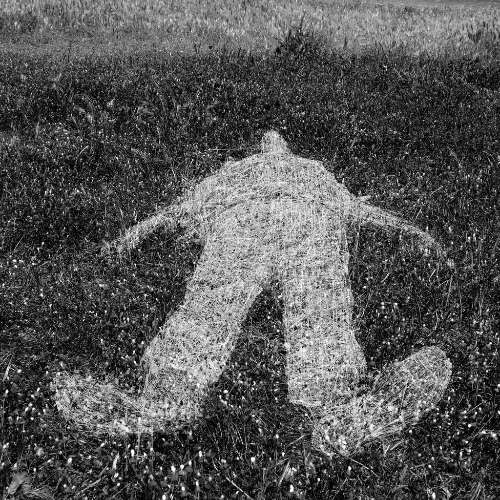 human-figure-outline-imprinted-on-grass-picture-id177395889